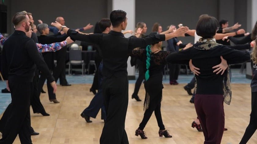 Dancers from all ages dancing on dancefloor for a dance workshop